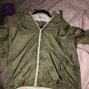 Olive green windbreaker.